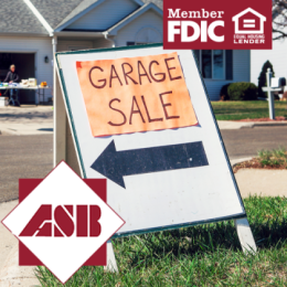 Close up of Garage Sale sign in front of house outside
