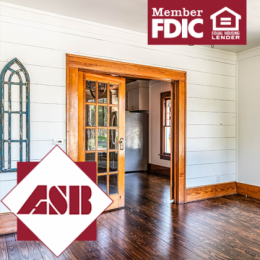 View of home interior with shiplap added, fresh paint job and gleaming wood windows