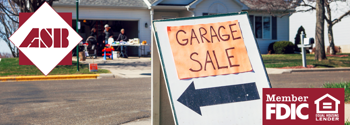 Close up of Garage Sale sign in front of house outside