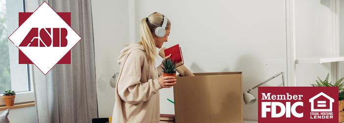 Girl packing box with all of her things in it