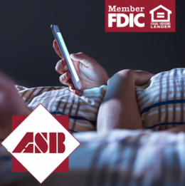 Two people lying in bed both on their phones