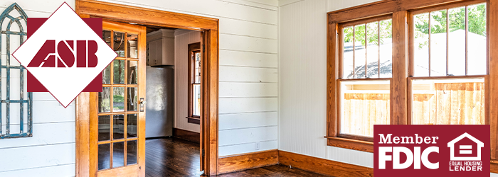 View of home interior with shiplap added, fresh paint job and gleaming wood windows